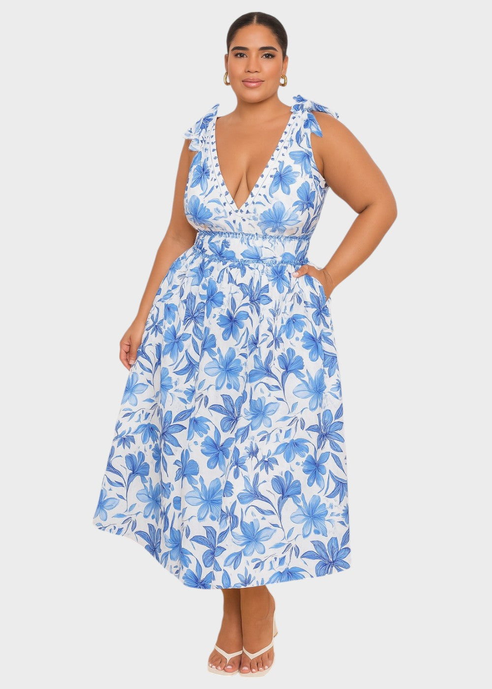 Maillot de bain bleu bohème à fleurs avec décolleté en V et jupe, lacé devant